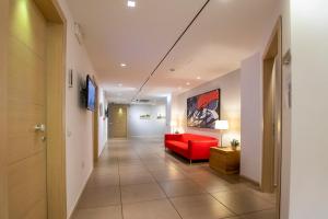 Телевизор и/или развлекательный центр в Hotel Dimorae Rooms and Suites - Apartments