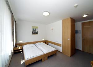 Rúm í herbergi á Hotel Kolping Wien Zentral