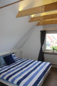 Postel nebo postele na pokoji v ubytování AAR Nordsee Appartement