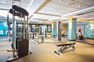 a gym with several treadmills and exercise bikes at Clarion Hotel & Suites Conference Center Memphis Airport in Memphis