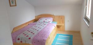 A bed or beds in a room at Apartment Pri Vrtnici