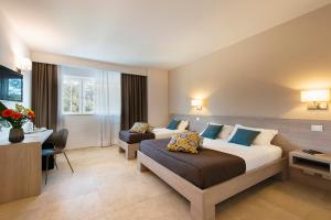 Кровать или кровати в номере Hotel Dimorae Rooms and Suites - Apartments