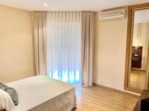 Posteľ alebo postele v izbe v ubytovaní Hotel Fernando IV
