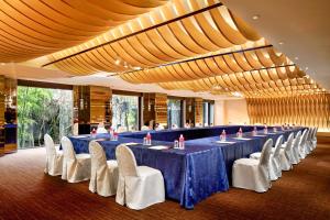 a large meeting room with a long table and chairs at ANA Crowne Plaza Hotel Kyoto by IHG in Kyoto