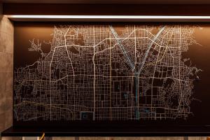 a drawing of a city map on a wall at KéFU stay & lounge in Kyoto