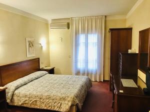 Postel nebo postele na pokoji v ubytování B&B Franceschi