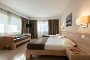 Кровать или кровати в номере Hotel Dimorae Rooms and Suites - Apartments