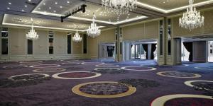 a large room with chandeliers and a purple floor at Crowne Plaza Istanbul Oryapark by IHG in Istanbul