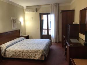 Postel nebo postele na pokoji v ubytování B&B Franceschi