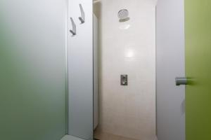 a shower with a glass door in a bathroom at Agricampeggio Relax (Campsite) in Brenzone sul Garda