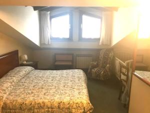 Postel nebo postele na pokoji v ubytování B&B Franceschi