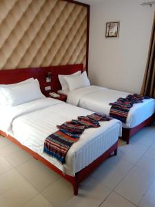 Postel nebo postele na pokoji v ubytování seven7days hotel