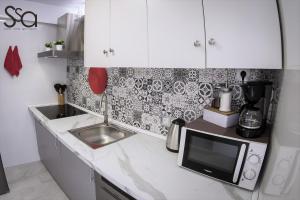Kuchnia lub aneks kuchenny w obiekcie My Sweet Red Apartment