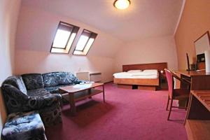 Voodi või voodid majutusasutuse Hotel Koruna toas