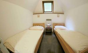 Voodi või voodid majutusasutuse Hotel Koruna toas