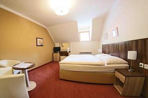 Voodi või voodid majutusasutuse Hotel Koruna toas