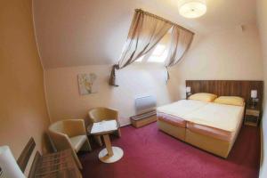 Voodi või voodid majutusasutuse Hotel Koruna toas