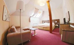 Voodi või voodid majutusasutuse Hotel Koruna toas