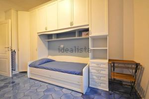 a bedroom with a bed and a desk in it at Luxury Apartment Amalfi in Amalfi