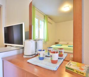 Kuchyň nebo kuchyňský kout v ubytování Room 4 Two