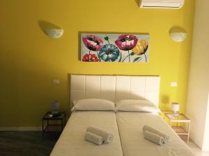 a bedroom with a bed with two pillows on it at Affittacamere Roma Tiburtina in Rome