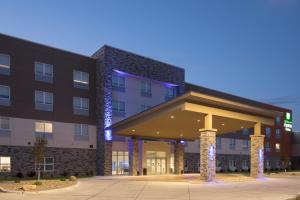 a large building with a clock on the front of it at Holiday Inn Express & Suites - Dakota Dunes, an IHG Hotel in Dakota Dunes