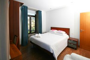 Cama ou camas em um quarto em Dias House