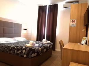 Voodi või voodid majutusasutuse Academy Hotel toas