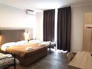 Voodi või voodid majutusasutuse Academy Hotel toas