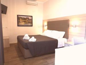 Voodi või voodid majutusasutuse Academy Hotel toas