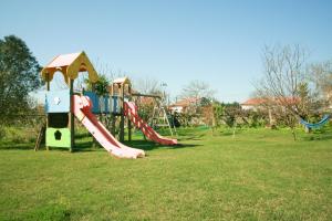 a playground with a slide in a park at Dias House in Viana do Castelo