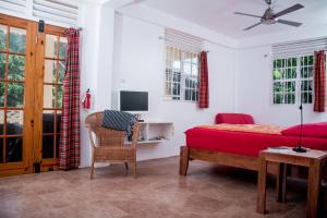 TV o dispositivi per l'intrattenimento presso Mango Garden Cottages