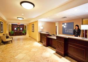 a woman standing in a waiting room at a hospital at Holiday Inn Express & Suites Niagara Falls by IHG in Niagara Falls