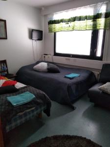 Кровать или кровати в номере Tervolahovi Lappland +15 фотографий