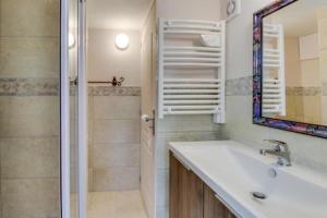 a bathroom with a sink and a shower and a mirror at Provence Dream Chalet in Uchaux +18 photos