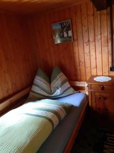 A bed or beds in a room at Platzerhütte