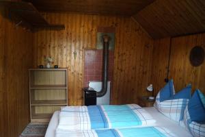 Tempat tidur dalam kamar di Platzerhütte