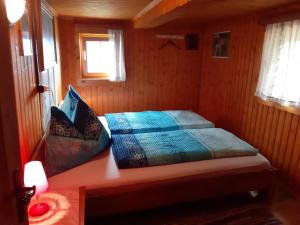A bed or beds in a room at Platzerhütte