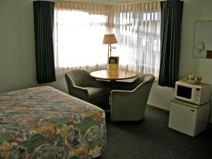Postel nebo postele na pokoji v ubytování Azalea Lodge