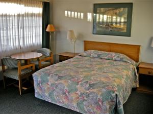 Postel nebo postele na pokoji v ubytování Azalea Lodge