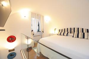 En eller flere senger på et rom på Gio Suite Amalfi