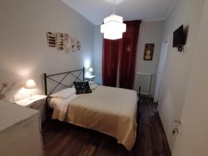 Postel nebo postele na pokoji v ubytování Segui le note della Tua vita