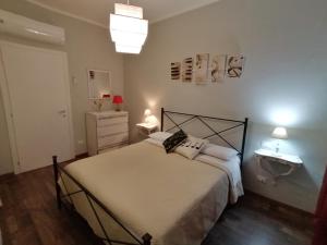 Postel nebo postele na pokoji v ubytování Segui le note della Tua vita