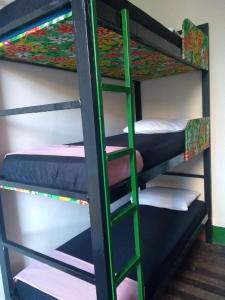 a bunk bed with four bunk beds in a room at Lapa Casa Hostel in Rio de Janeiro