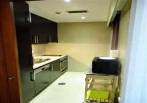 a small kitchen with a sink and a counter at Dunas in Viana do Castelo +16 photos