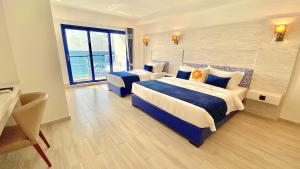 Кровать или кровати в номере Kaani Palm Beach