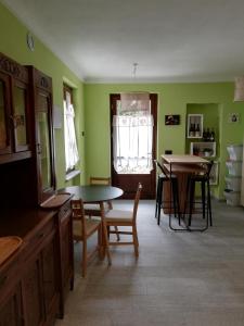 a kitchen with a table and chairs and a dining room at A cà ed Franca e Giaco in La Morra +43 photos