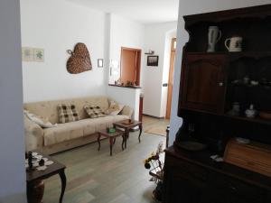 a living room with a couch and a table at Villa Frane 101 in Beli