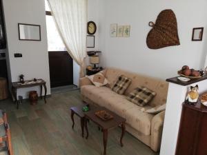 a living room with a couch and a table at Villa Frane 101 in Beli