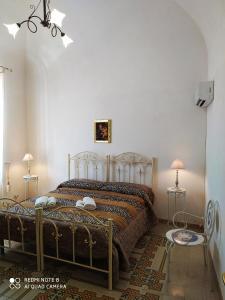 Säng eller sängar i ett rum på Agli Antichi Quartieri Apartments